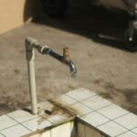 a pipe sticking out of the side of a building